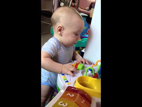 Miracle Baby Playing With Leap Frog